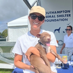 Jenn LaVardera holding a puppy